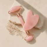Alurea Roller and Gua Sha Kit - facial massage tools on stone surface